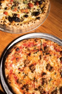 A King Dough pie topped with hot honey